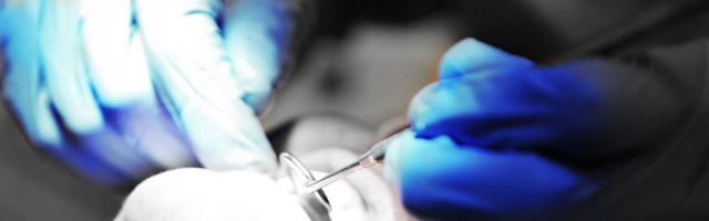 Concerned patient discussing metallic taste with dentist at Christchurch Dental