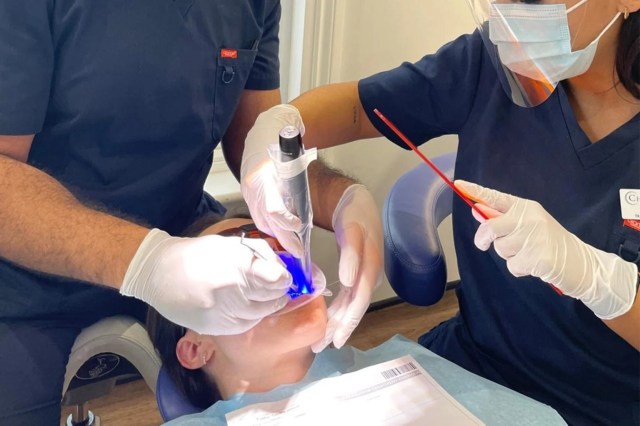 Nurse Tabitha receiving dental treatment at Christchurch Dental as part of her Invisalign journey
